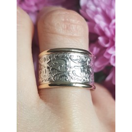 Sterling silver and gold wedding band 