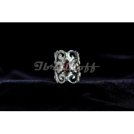 Silver sterling ring with red central granate and pink side granates