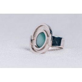Large sterling silver ring, with watery greenish cat’s eye stone