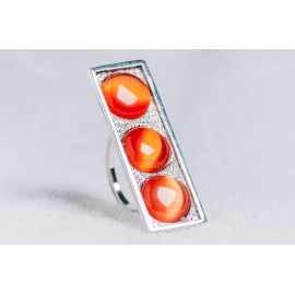 Large sterling silver ring with three orange cat’s eye stones