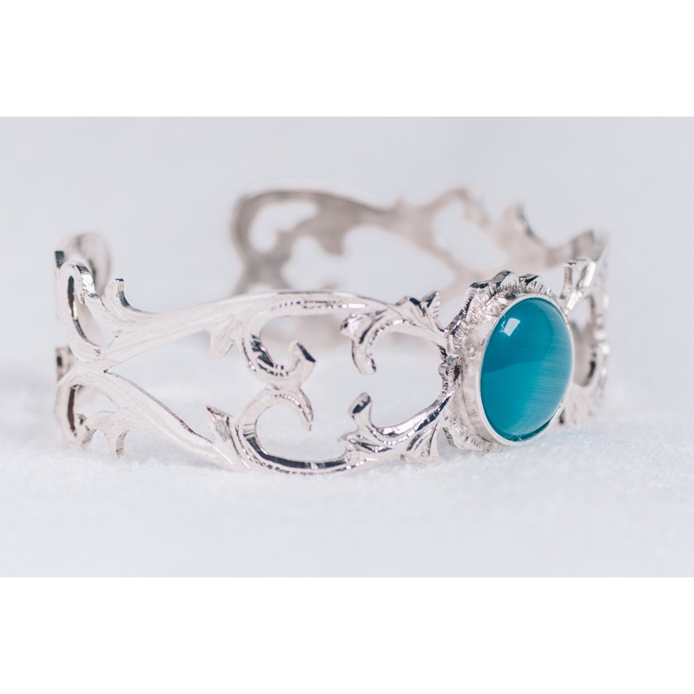Sterling silver ring with bluish cat’s eye stone, engraved